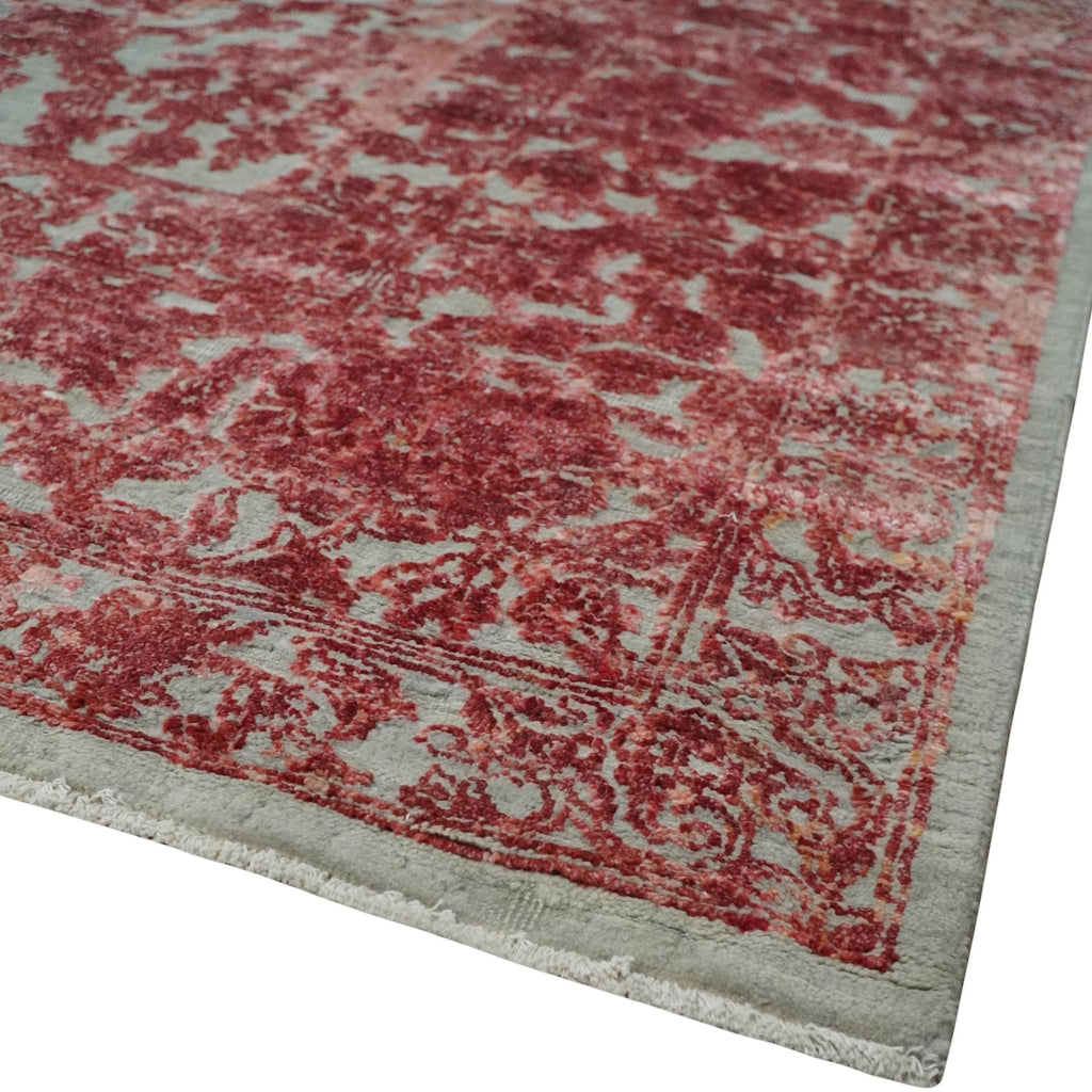 Close-up of a red and gray patterned rug corner