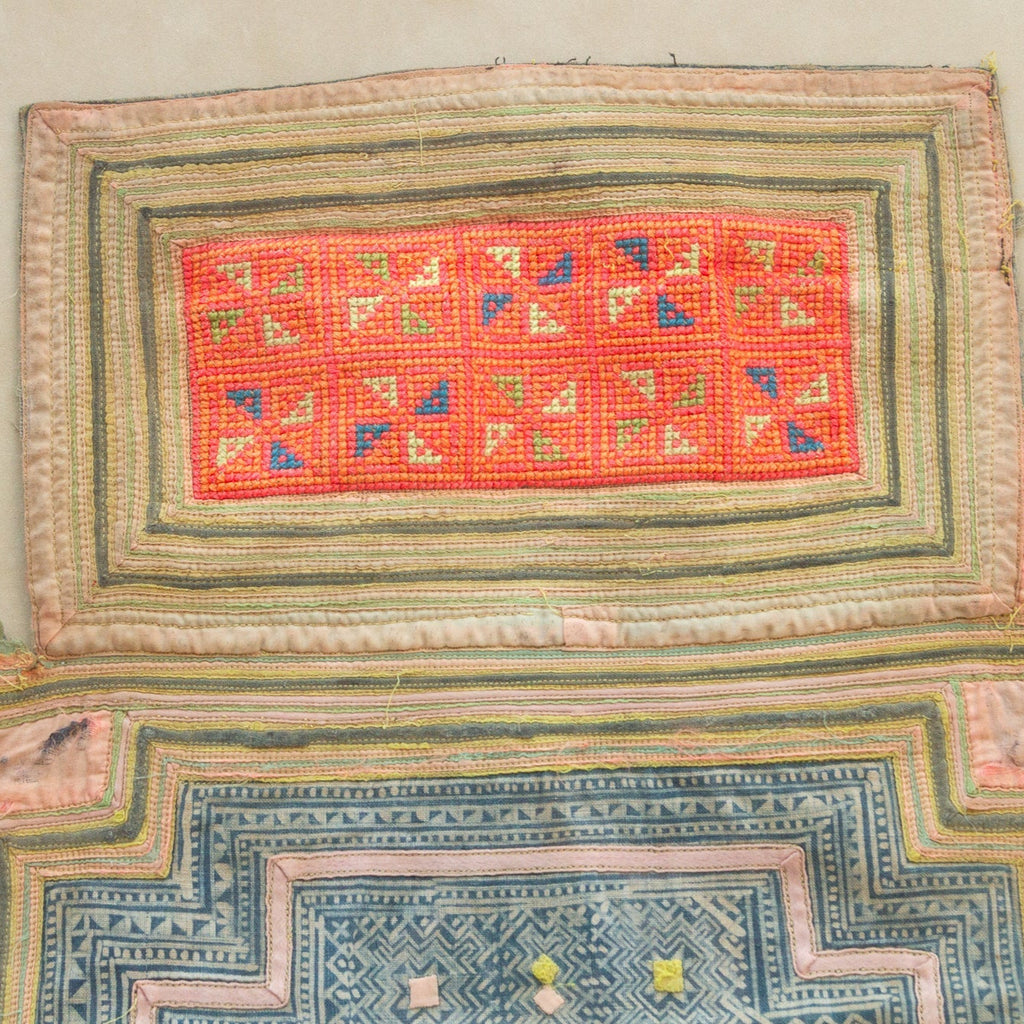 Decorative textile with geometric patterns on a beige background