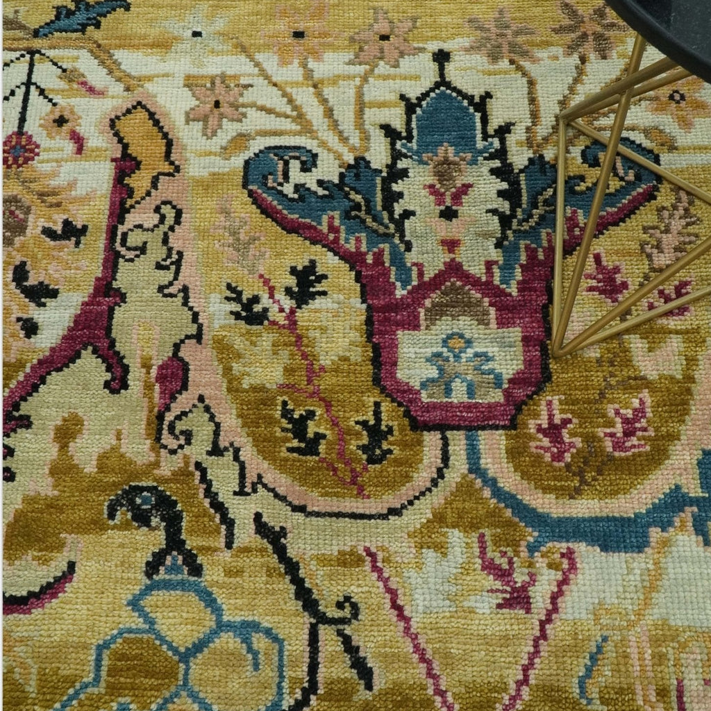 Close-up of a patterned rug with intricate designs on a yellow background